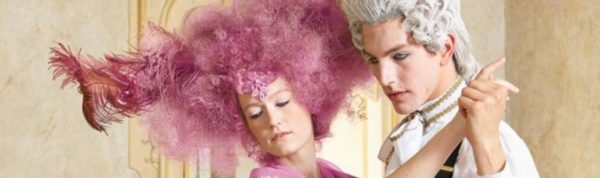 a couple of people that are on some grass